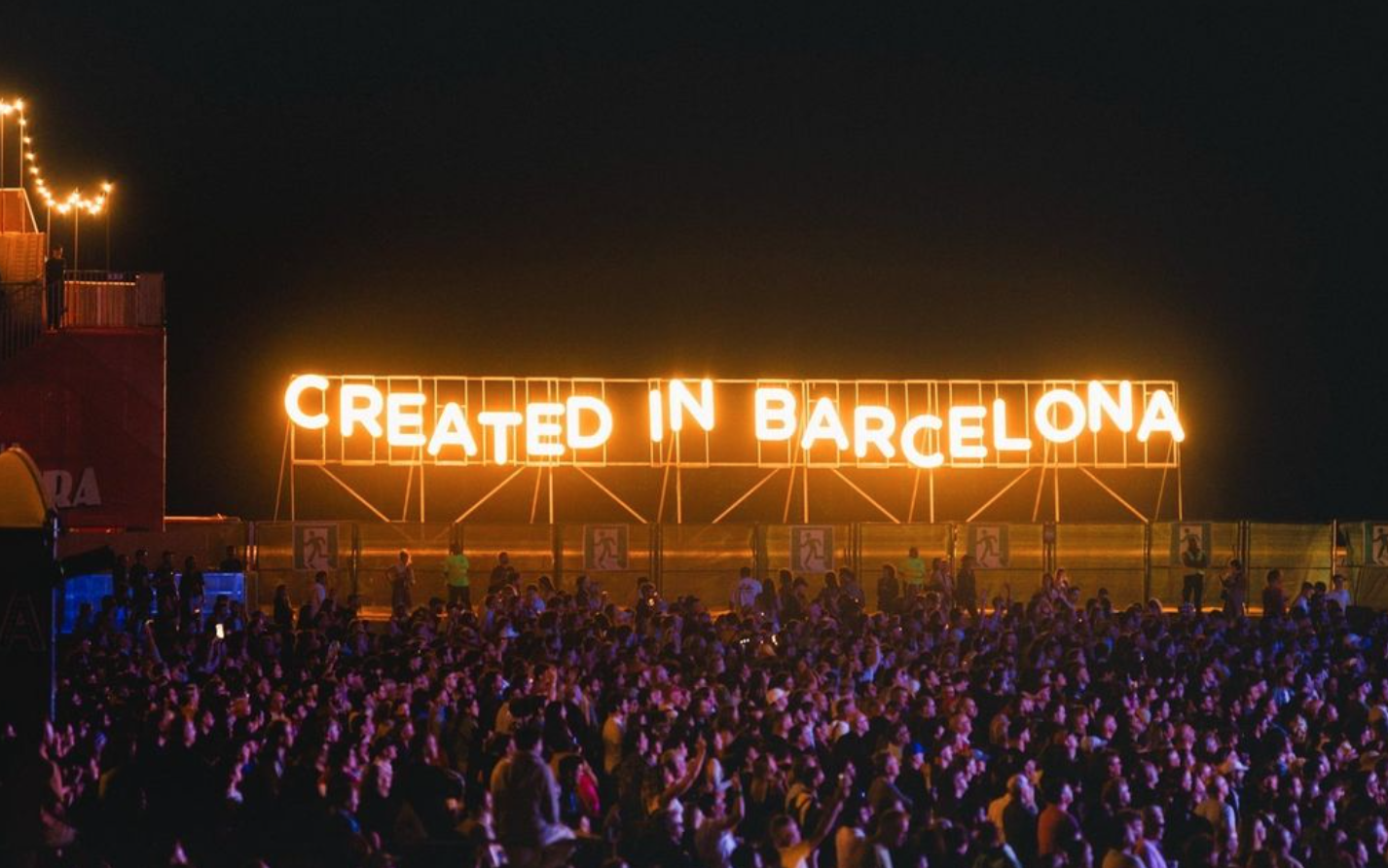 Made In Barcelona light up sign with fans in front